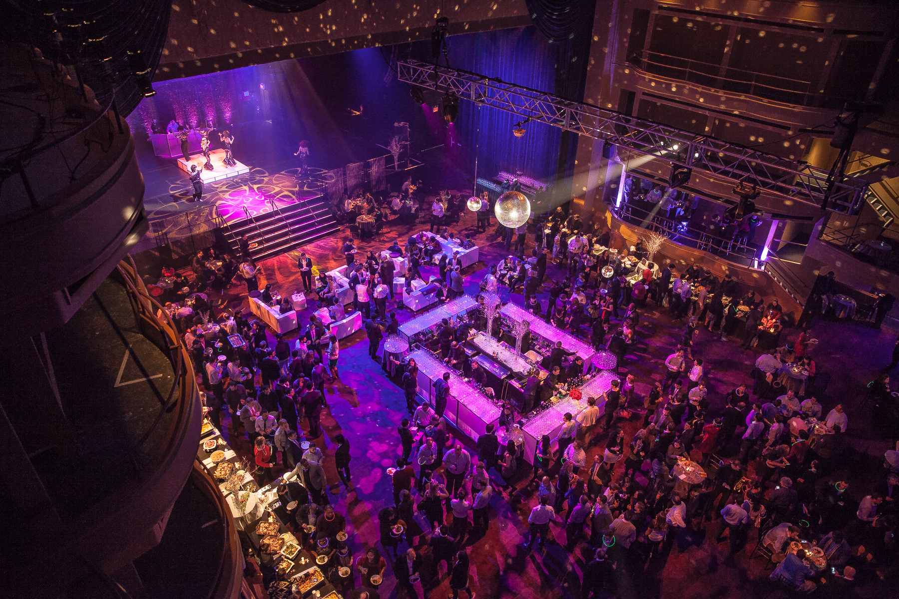 cocktail party 2 A modern audio-visual control room featuring monitors, sound equipment, and a mixing console, branded with the Manhattan Center logo