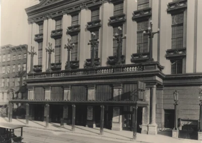 Close-up street-level historic photo of the Manhattan Center and ornate lampposts