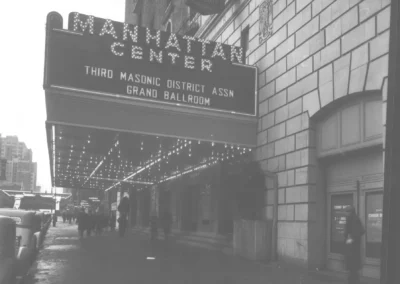 Nighttime archival photo of the Manhattan Center marquee with lit signage