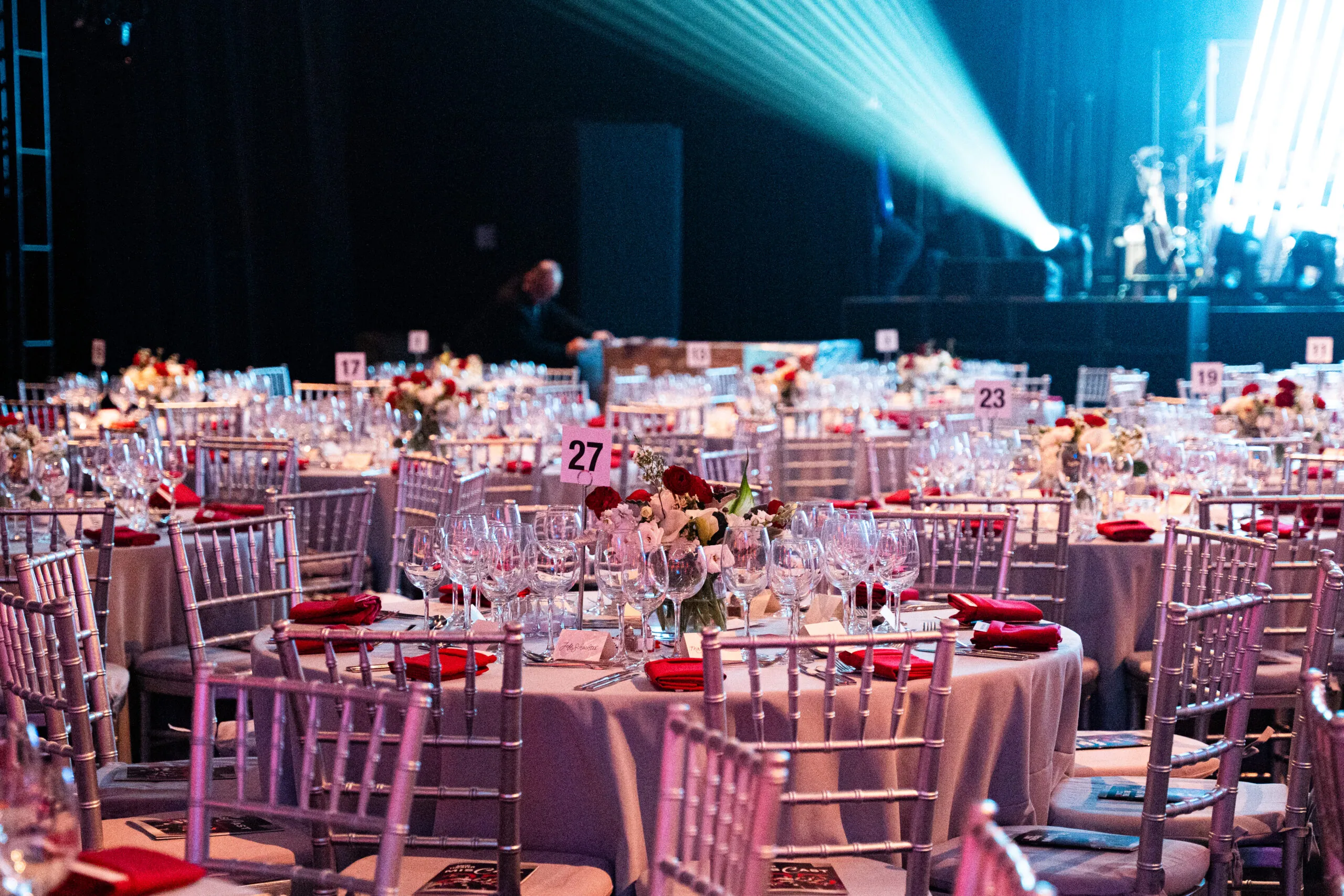A modern audio-visual control room featuring monitors, sound equipment, and a mixing console, branded with the Manhattan Center logo